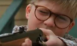 Ralphie using a Red Ryder BB gun